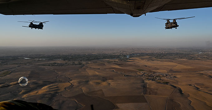 Two U.S. Army MH-47G Chinooks prepare to receive fuel